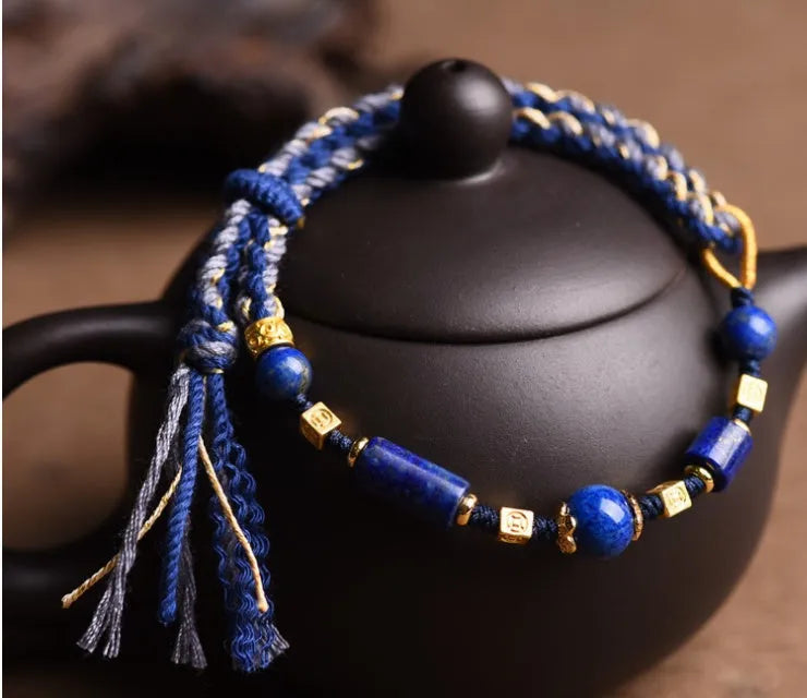 Hand-woven ethnic watch bracelet in flexible wire, showing Hongfei Ebony and Lapis Lazuli colour options.