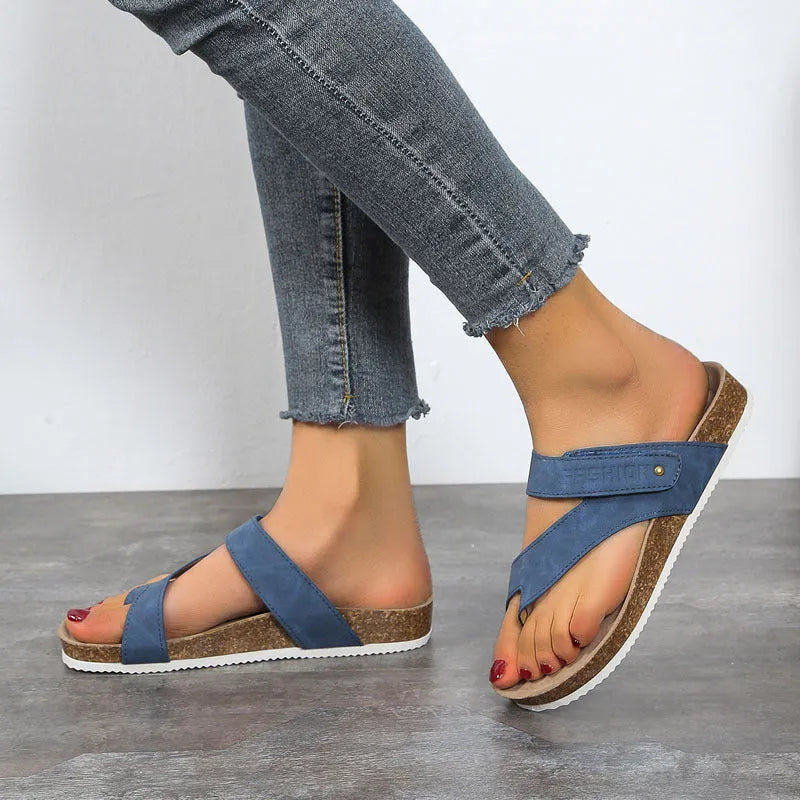Flat toe ring thick-soled flip-flops in blue, showing artificial PU upper and foam sole.