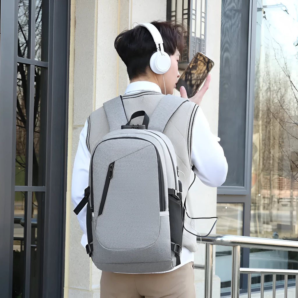 Solid-colour Oxford cloth computer backpack with 20-35L capacity in grey, black, blue, or red options.