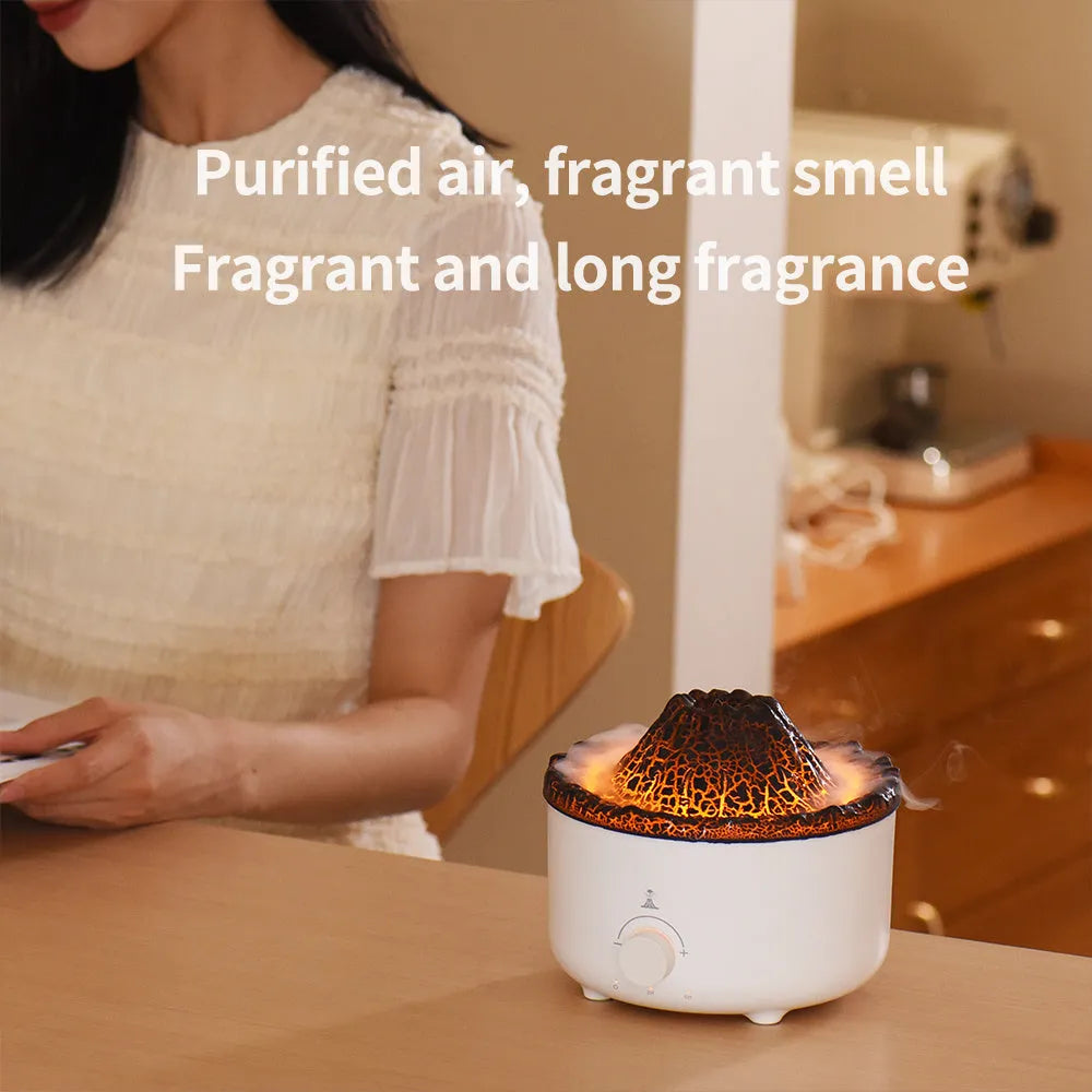 White simulated flame volcano humidifier diffuser with remote control on tabletop