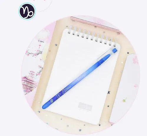 Boxed set of 12 constellation-themed quick-drying gel pens with plastic barrels.