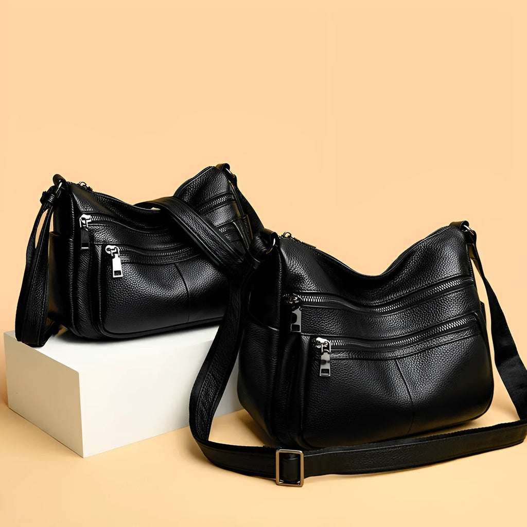 First layer cowhide genuine leather pillow-shaped shoulder messenger bag in black, small size