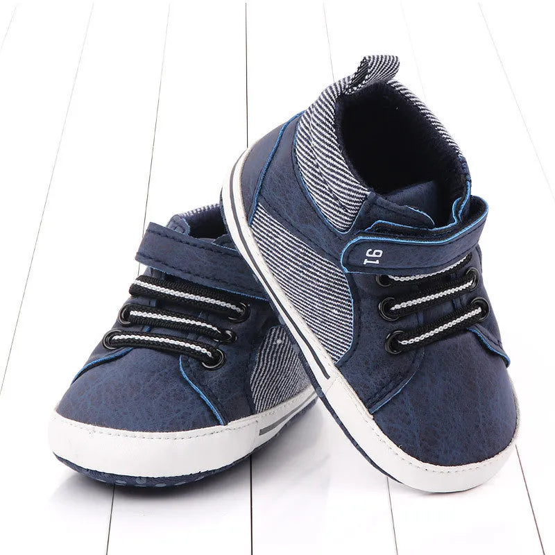 Blue high-top cotton toddler shoes for boys with a Velcro strap fastening.