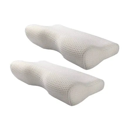 Blue butterfly-shaped memory foam cervical neck pillow on a bed