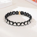 Rainbow coloured alloy heart charm on a stretch bracelet with a diamond-effect finish.