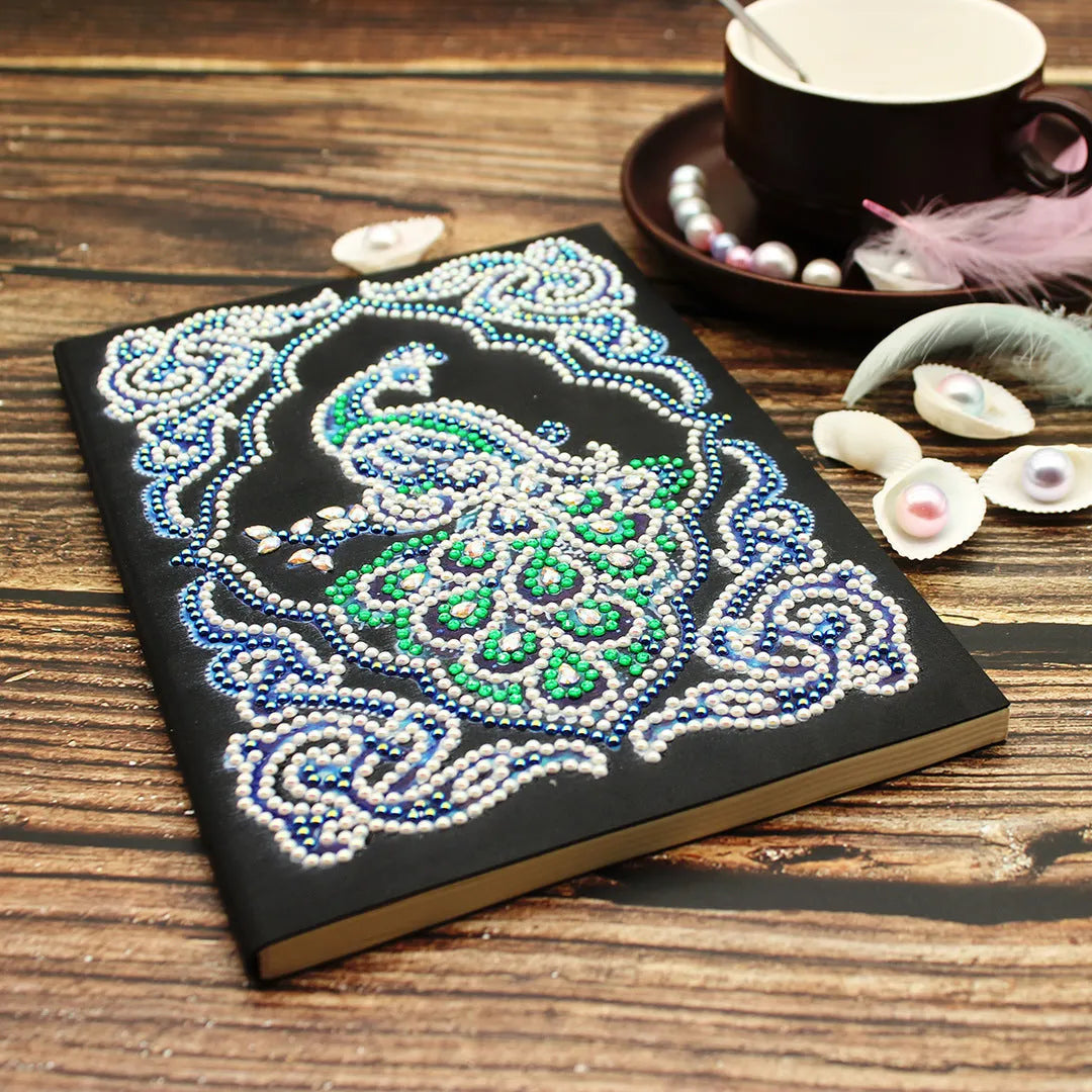 Black A5 diamond painting notebook for creating a peacock-themed journal with shaped drills.