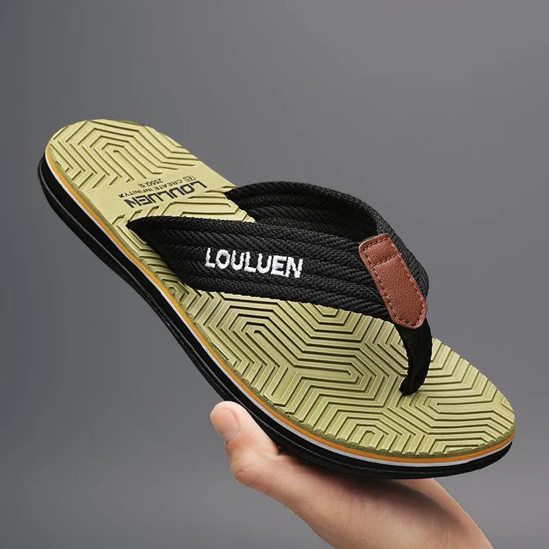 Men's black flip flops with non-slip sole and EVA upper on a beach background