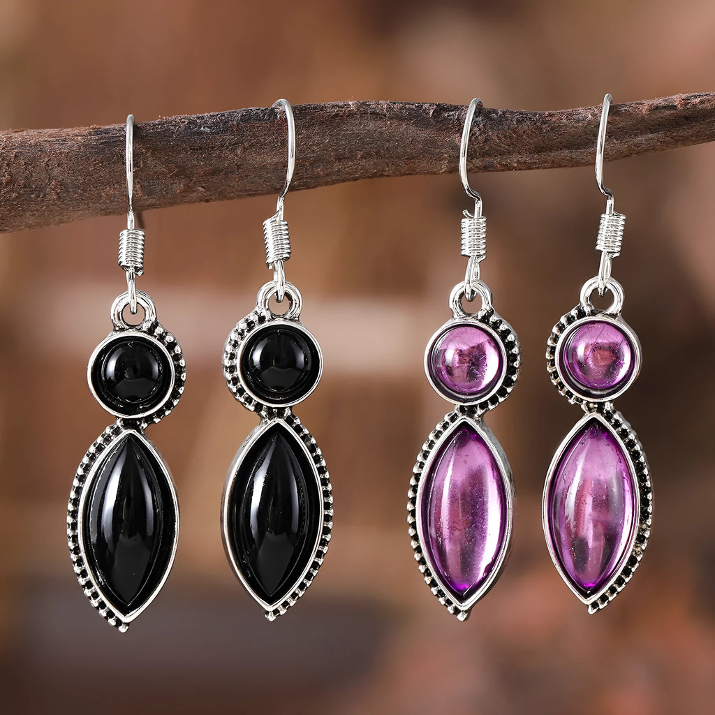 A pair of vintage-style geometric earrings with a black and purple electroplated finish on a zinc alloy base.