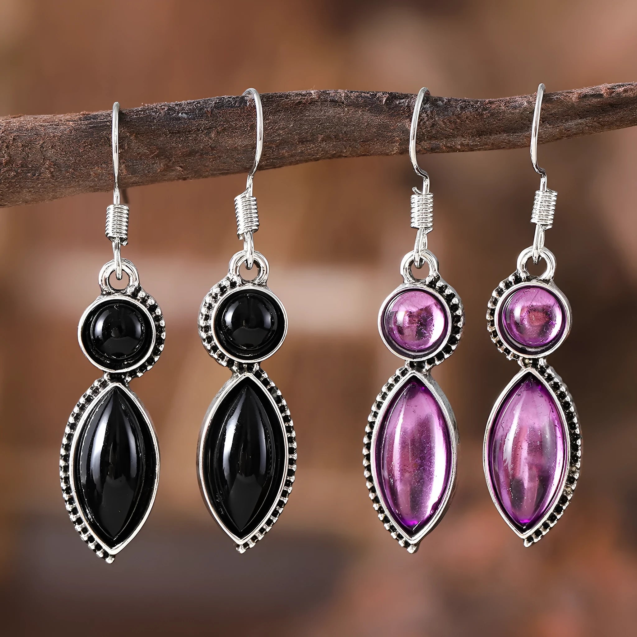 A pair of vintage-style geometric earrings with a black and purple electroplated finish on a zinc alloy base.