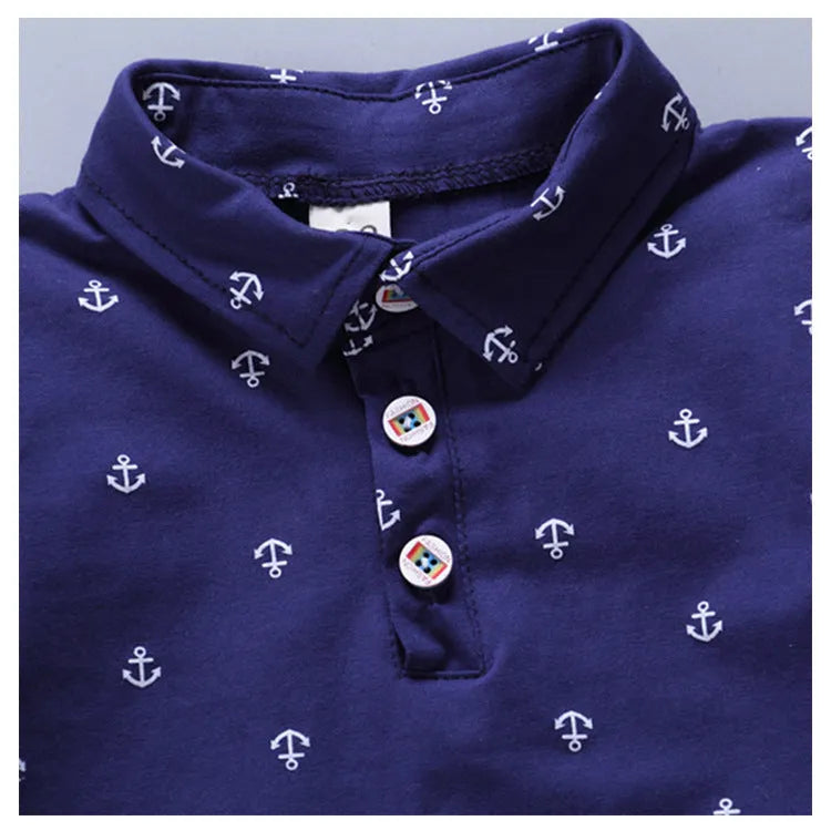 Infant anchor print cotton romper set in blue, showing short sleeves and matching trousers