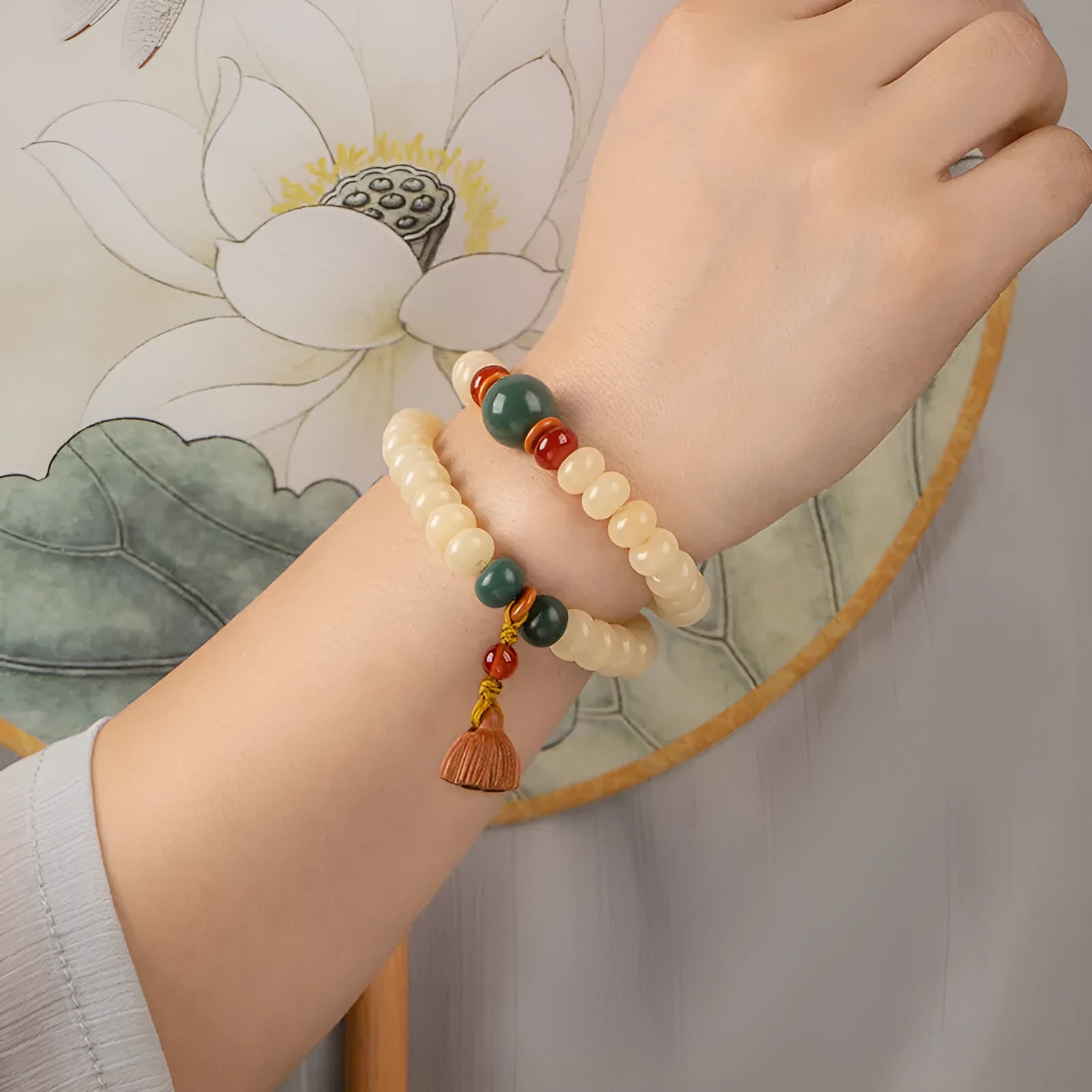 Wooden milk butter Bodhi root bracelet with 6x9mm flat round beads on wrist
