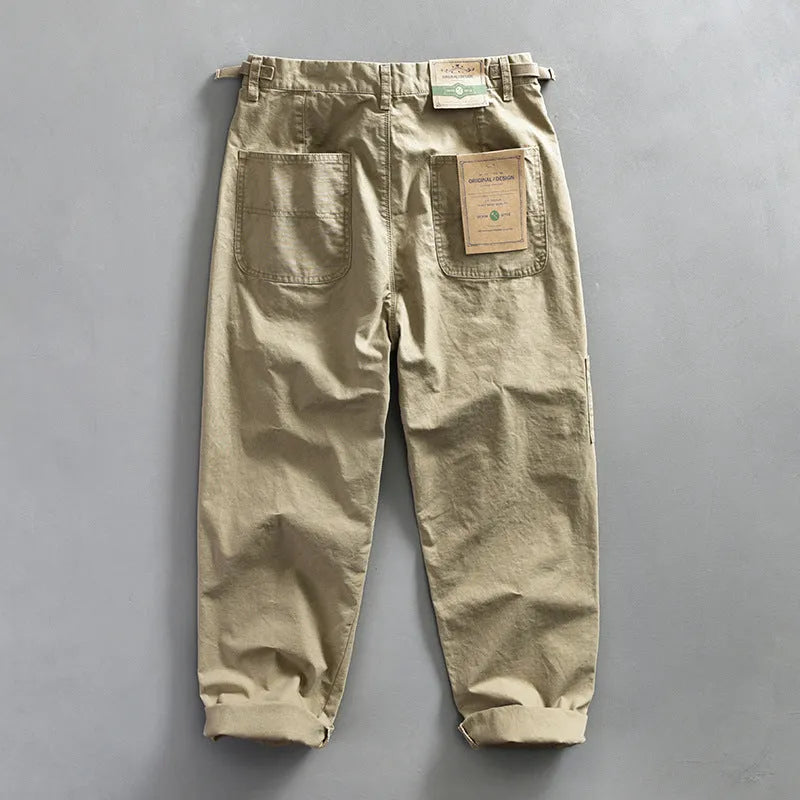 Men's straight-leg cotton casual trousers in apricot, shown flat.