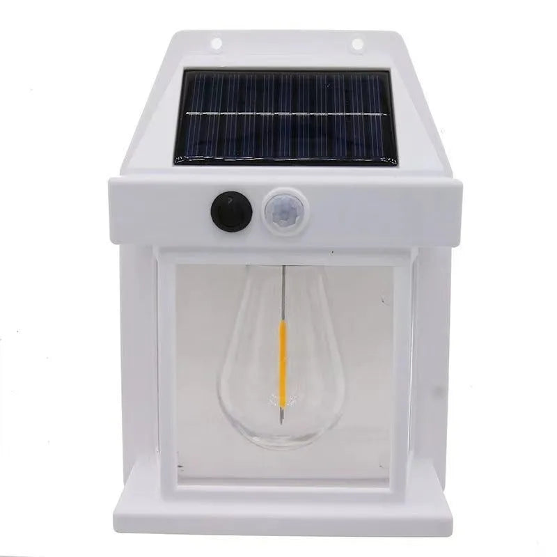 Solar tungsten wall lamp in black or white plastic with IP65 rating for outdoor garden and fence lighting