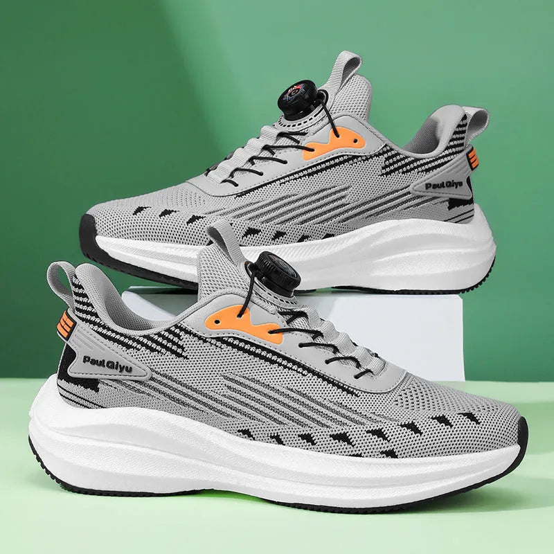 Men's white and green casual running shoes with rotating buckle and Fly-knit mesh upper on a flat TPU sole.