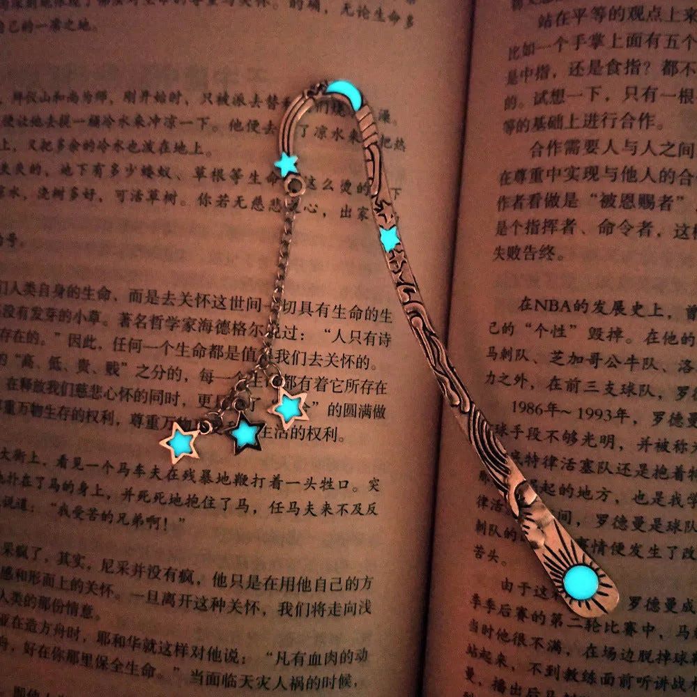 Retro five-pointed star glowing metal bookmark in ancient silver and bronze colours with celestial patterns