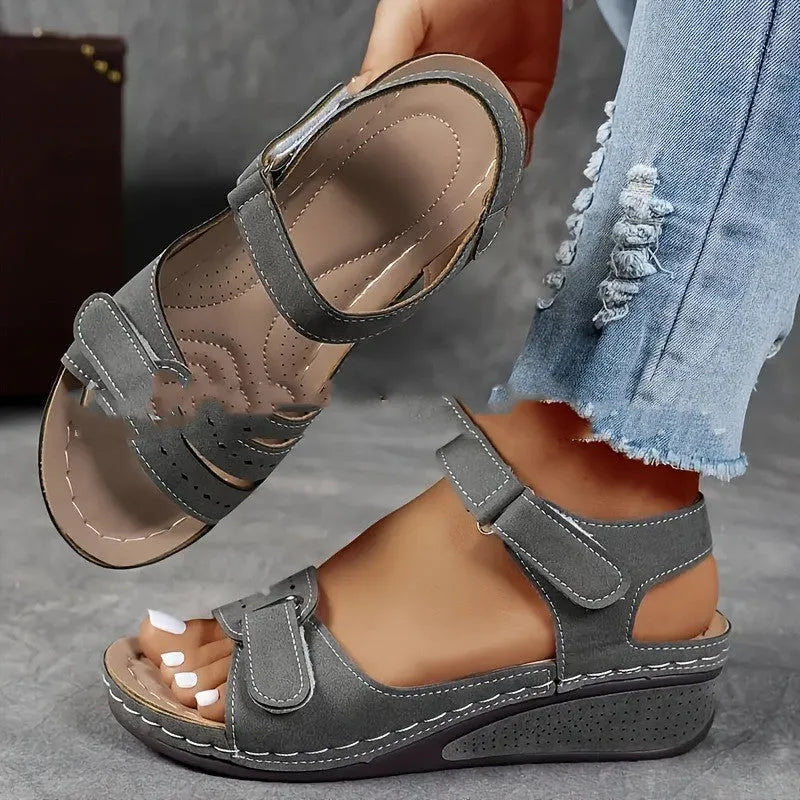 Women's thick bottom strap sandals with Velcro fastening in beige colour showing round toe and composite sole