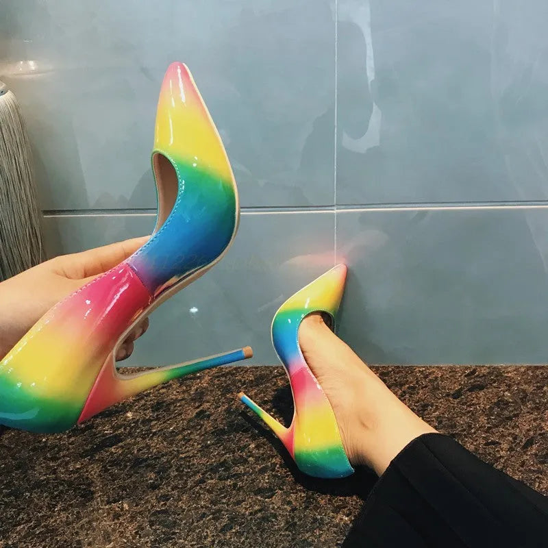 Women's rainbow patent leather high heel court shoes with pointed toe and thin ultra-high heel.