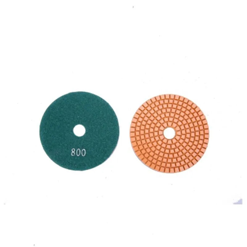 Set of 10 emery stone polishing pads showing 80mm diameter discs with central mounting holes