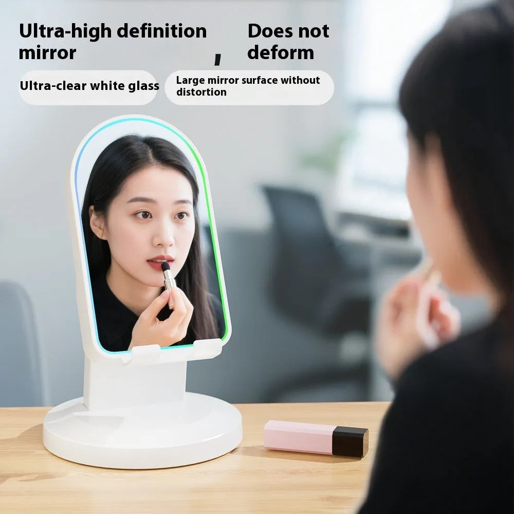 Three-in-one wireless induction speaker and Bluetooth phone bracket in black or white, with built-in battery and USB cable