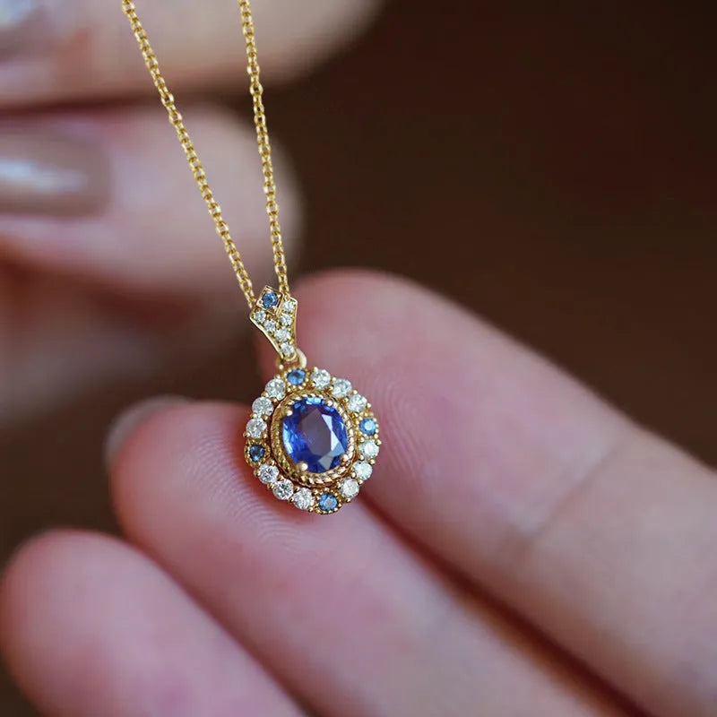 Yellow gold coloured copper necklace with a mixed gemstone pendant and box chain.