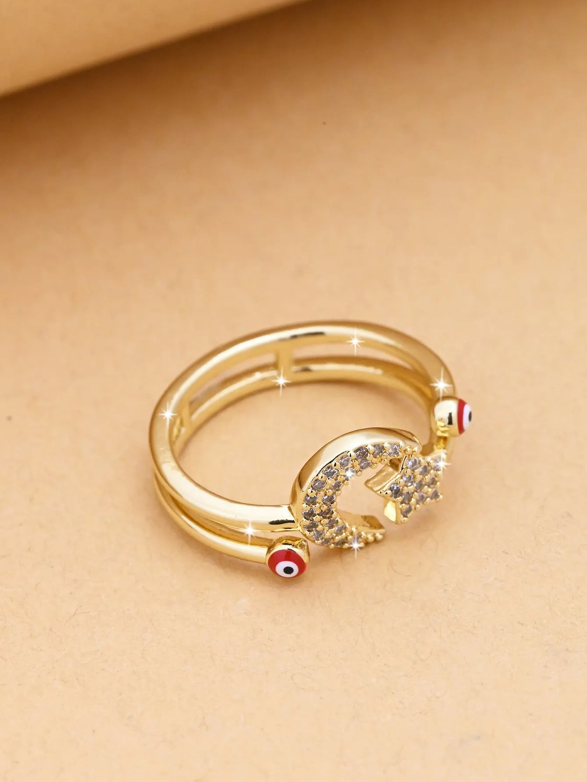 Devil's Eye open copper ring with electroplated finish, geometric eye design, shown in red, blue and white options