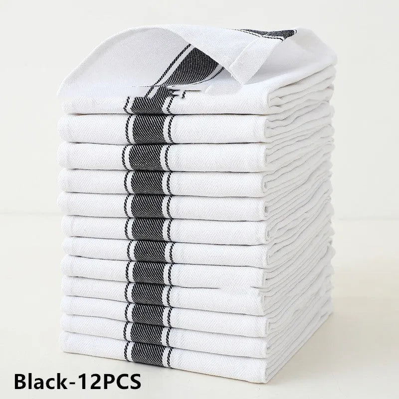 Set of twelve striped and solid coloured cotton dish towels laid flat showing 48x70cm size