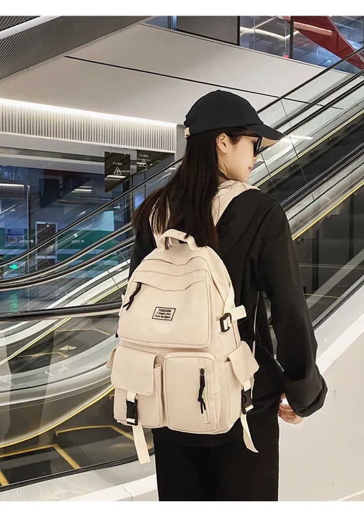 Black and white soft nylon student backpack with laptop compartment and three-dimensional pockets