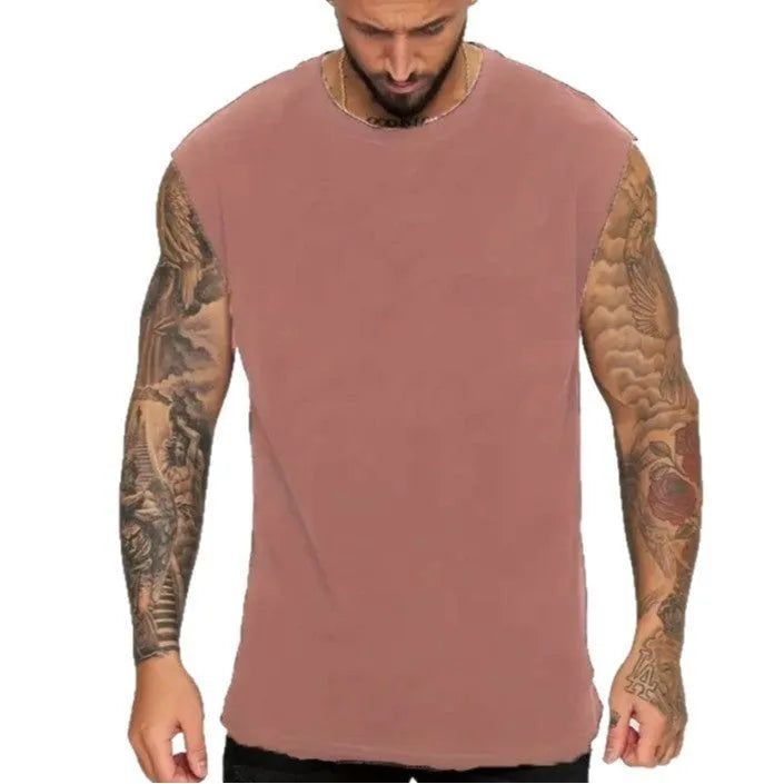 Men's loose apricot-coloured cotton tank top on a hanger.