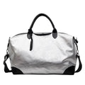 Women's hand-carrying travel bag in black or silver with 36-55L capacity