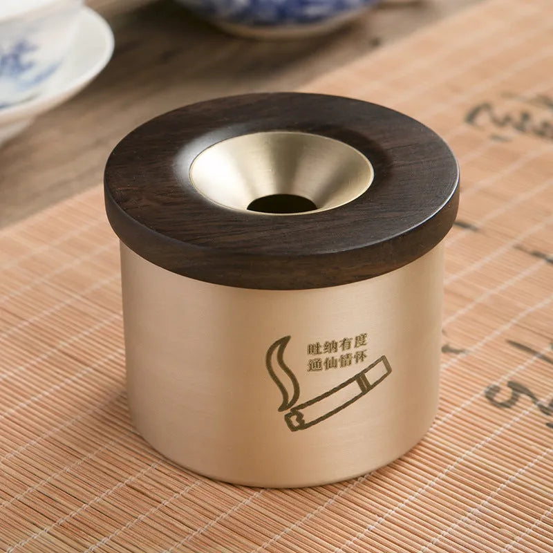 Retro brass ashtray with wooden lid showing centre hole design