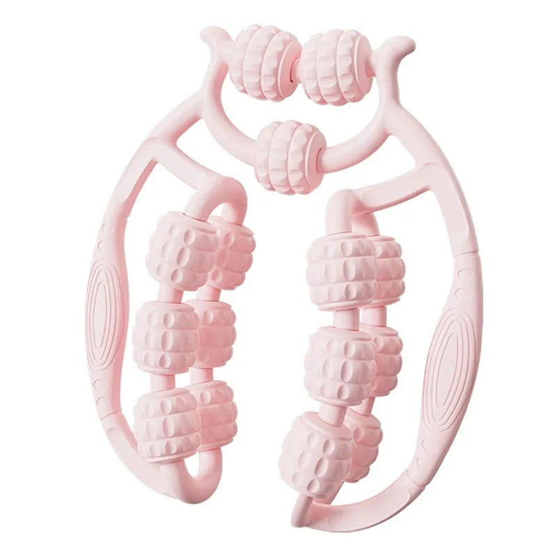 Ring clip leg roller massage tool with double-row wheels in coral pink on a leg.