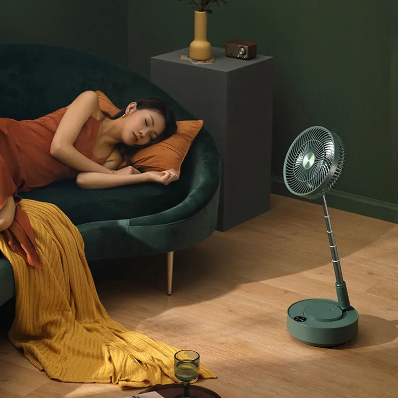 Green telescopic floor fan shown in both desktop and extended vertical positions with remote control