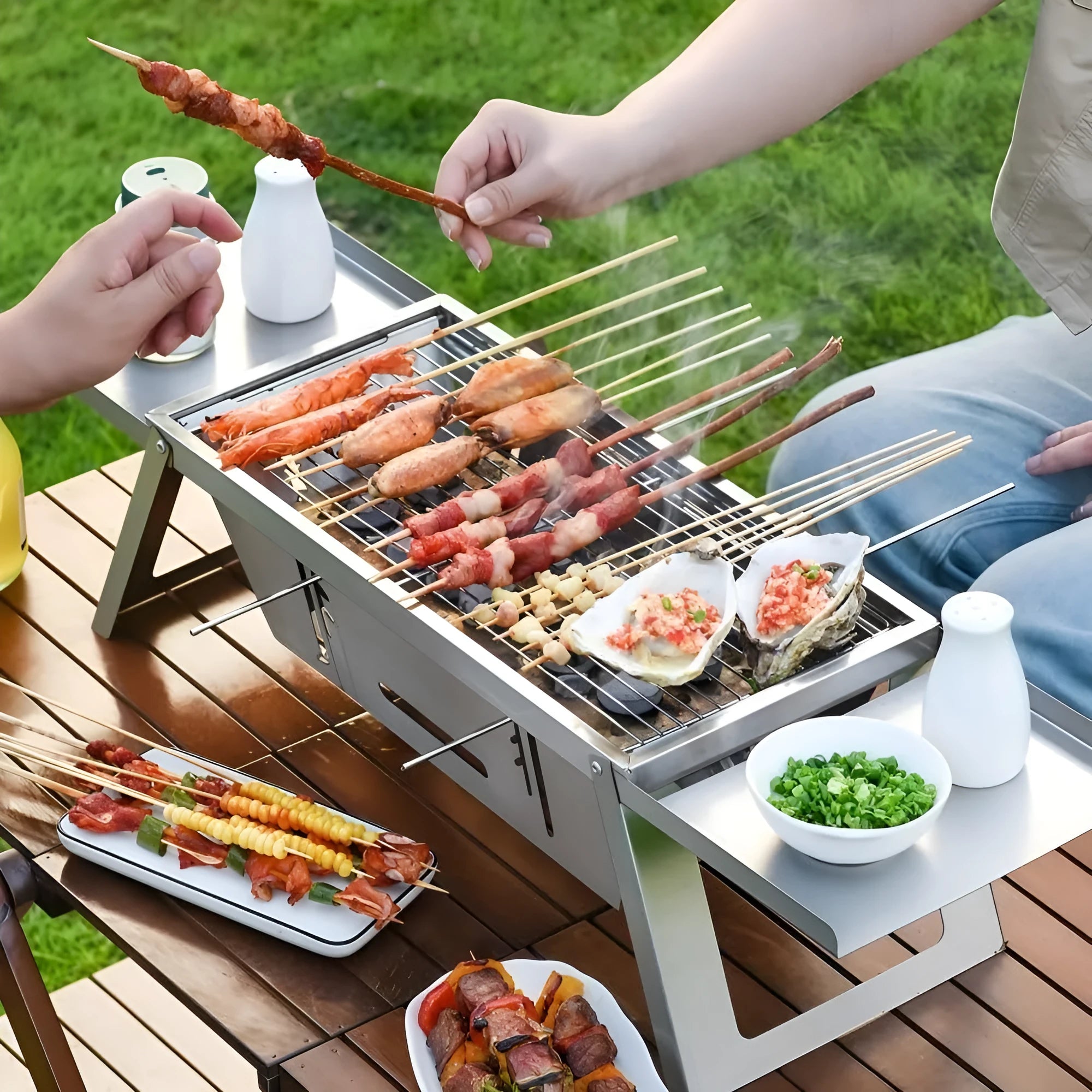 Small portable charcoal barbecue with foldable legs in a compact, folded position