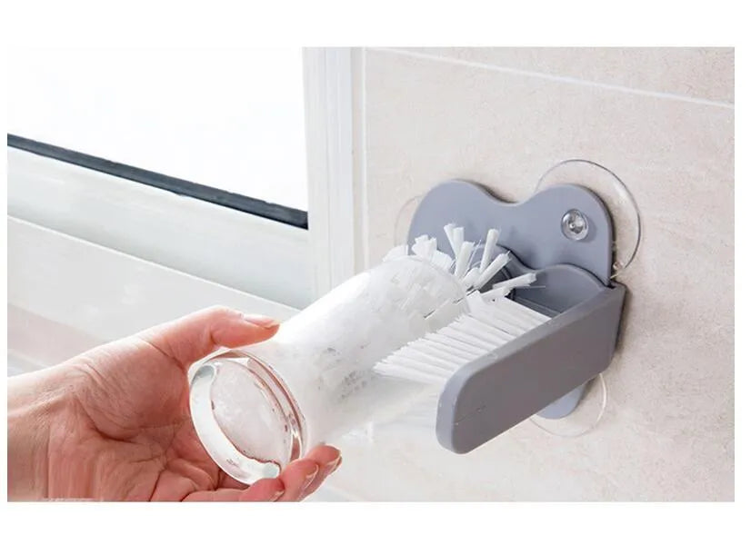 Grey double-head rotating cup brush with suction cups for wall mounting, length 17.5cm.