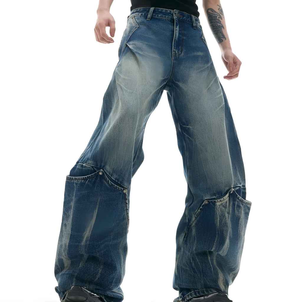 Men's Verdant blue loose-fit retro jeans with a faded burst pattern and curved knife leg design.