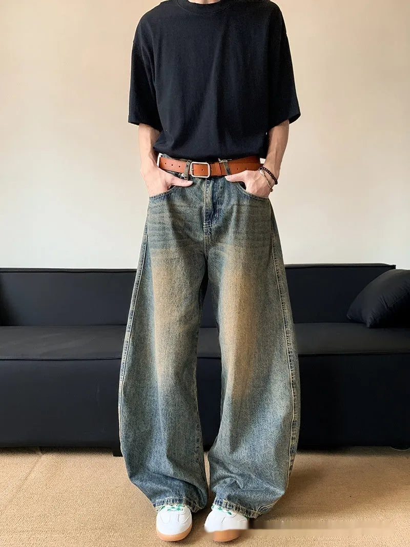 Retro blue distressed men's jeans with wide leg fit and micro elastic cotton blend fabric