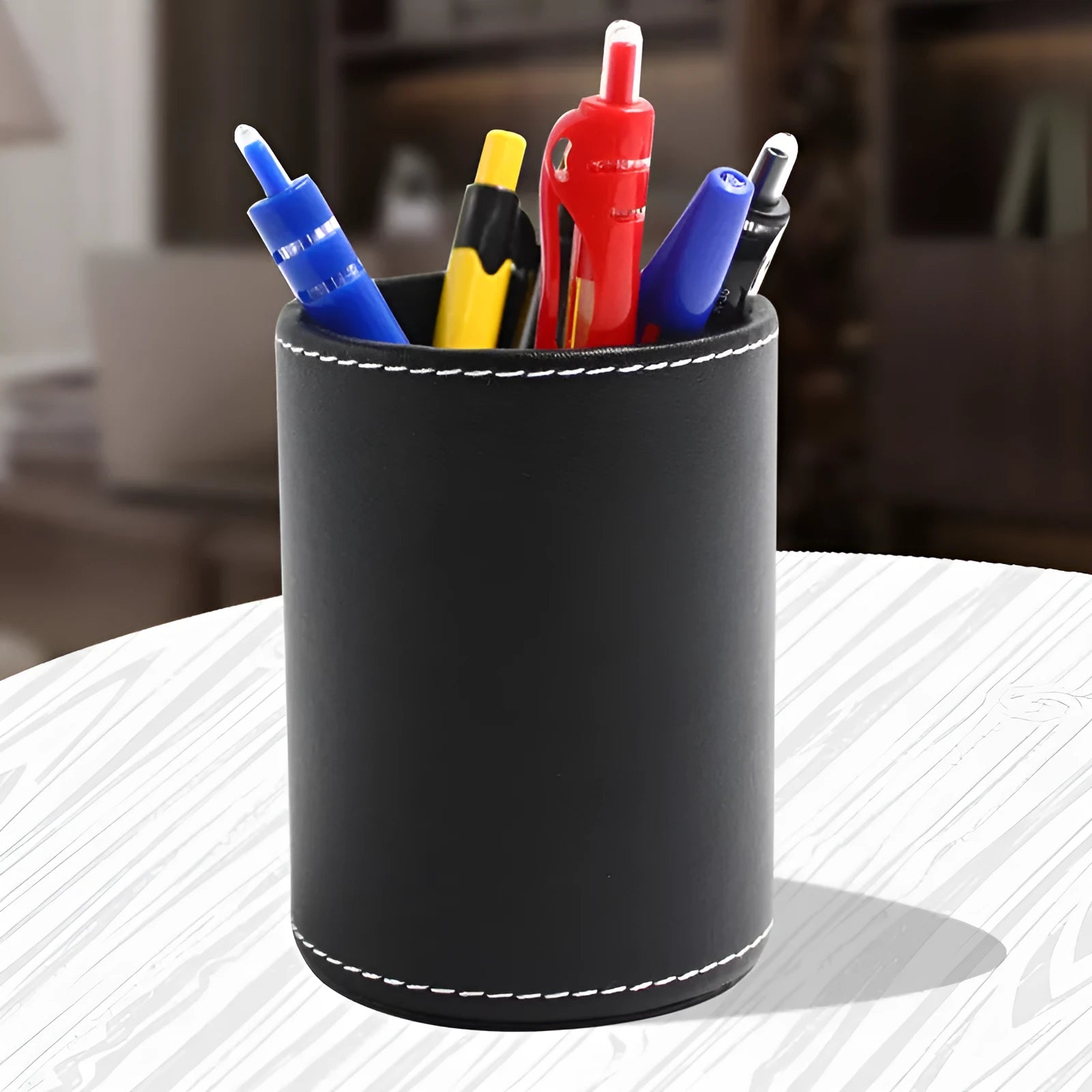 Black leather cylindrical pen container showing 8cm diameter and 10.8cm height dimensions
