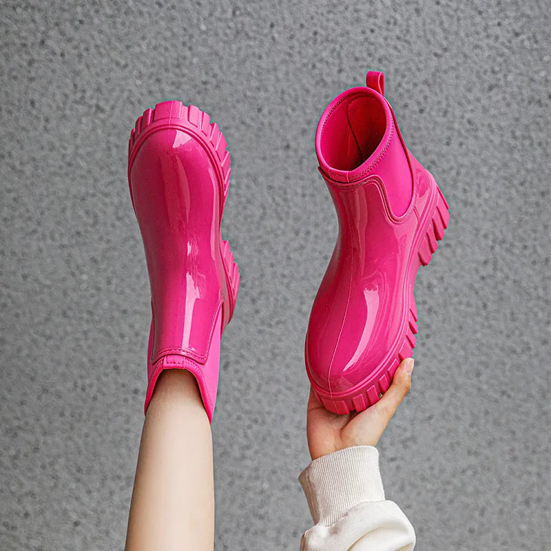 Low tube PVC rain boots in apricot colour with a non-slip sole and flat heel.