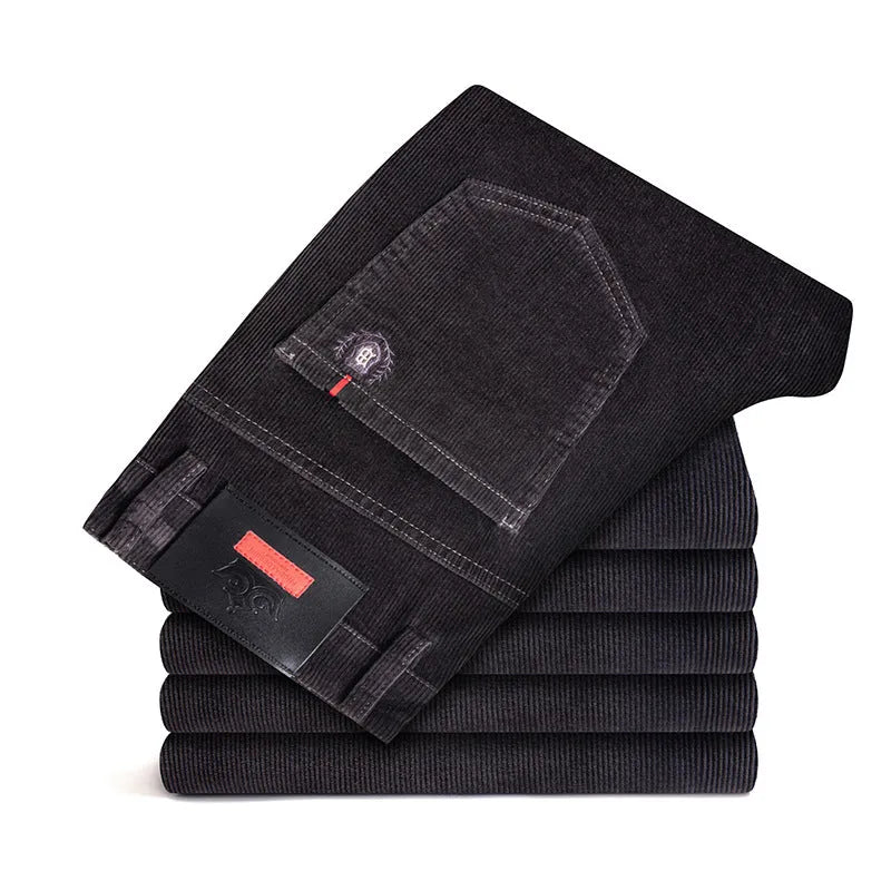 Men's thick corduroy straight trousers with belt in dark grey, shown folded on a neutral background.