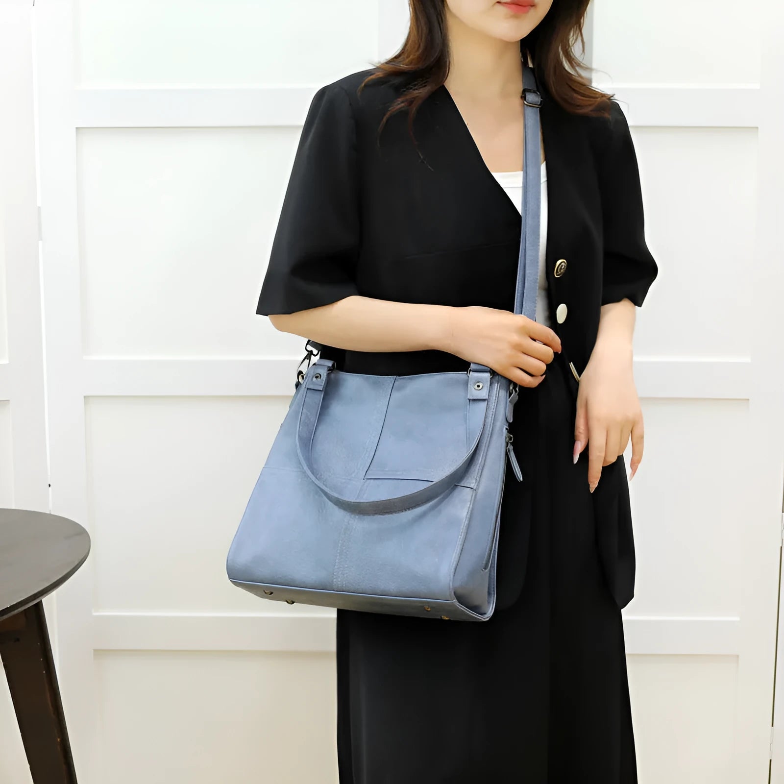 Barrel-shaped crossbody handbag in soft PU leather measuring 30 by 31.5 centimetres