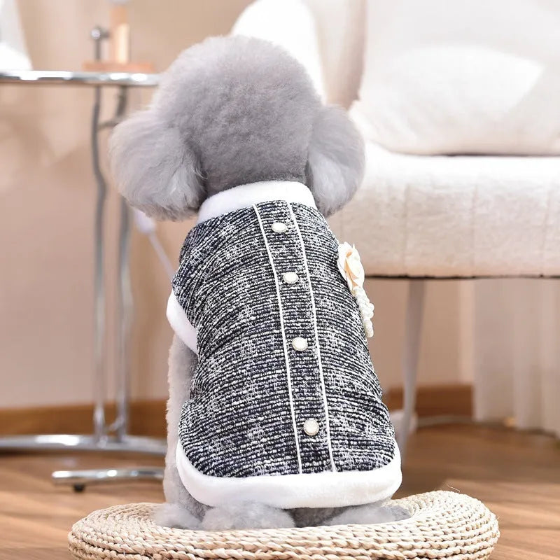 Black PU sausage jacket for cats shown on small feline model