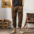 Men's cotton tapered harem trousers in black with elastic waistband and ankle band detailing
