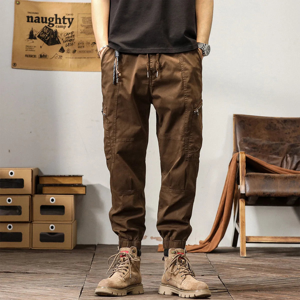 Men's cotton tapered harem trousers in black with elastic waistband and ankle band detailing