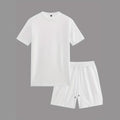 Man wearing a white waffle texture short sleeve blouse and matching shorts summer set.