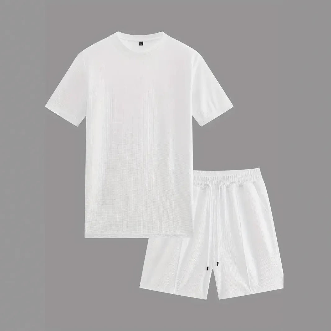 Man wearing a white waffle texture short sleeve blouse and matching shorts summer set.