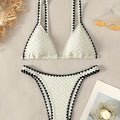 Women's split bikini swimsuit in briefs style available in white or blue colours