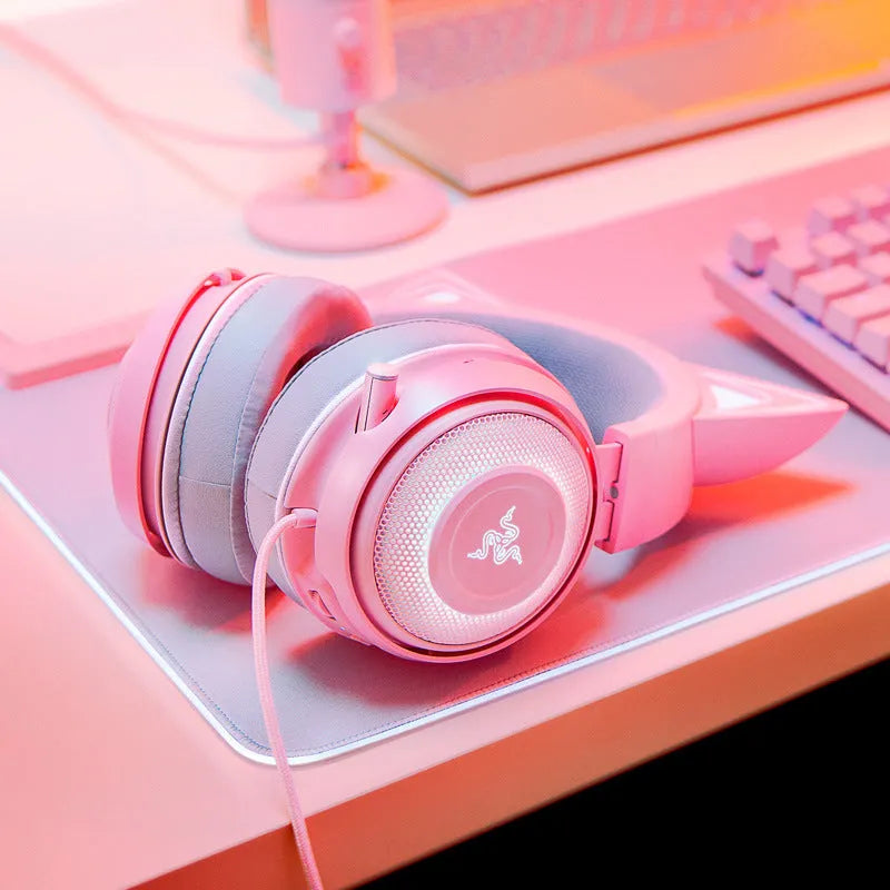 Pink wired USB cat ear headphones with glowing LED lighting on a head-mounted design