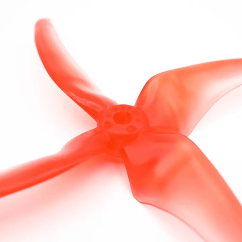 Red 5-inch crossing machine propeller with four plastic blades, shown as part of a two-pair set