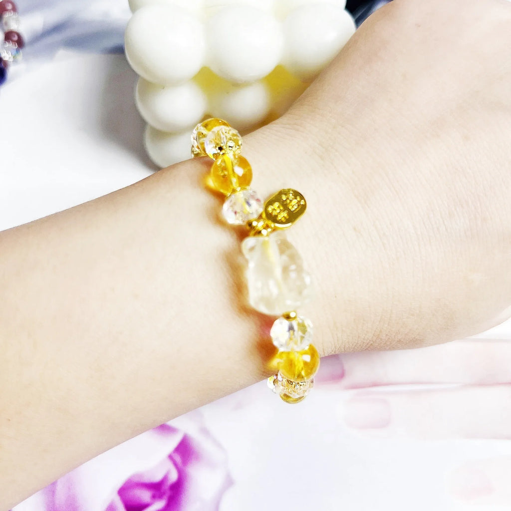 Natural citrine nine-tail fox crystal bracelet for women on a wrist.