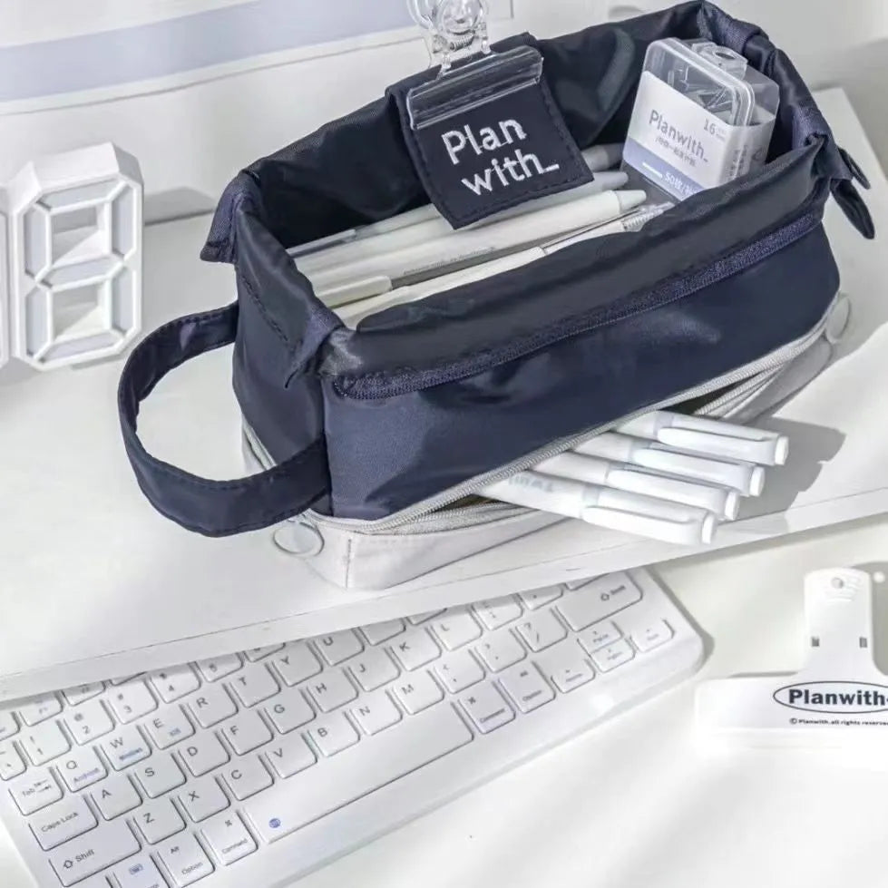 Folding double-layer student pencil case with two compartments and zippered closure in beige, blue, or navy blue colour